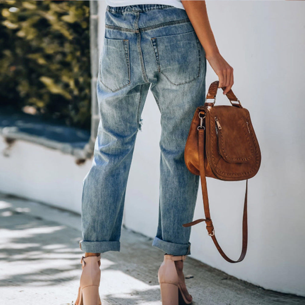 Ripped lace-up white trouser jeans